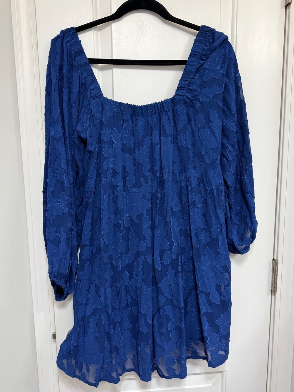 Dollfin’s Textured Blue tiered blouse